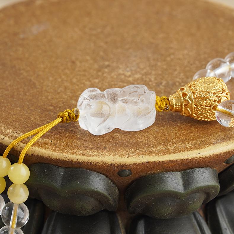 Handcrafted Tibetan Buddhist mala necklace made of white crystal, amber, and 925 silver.