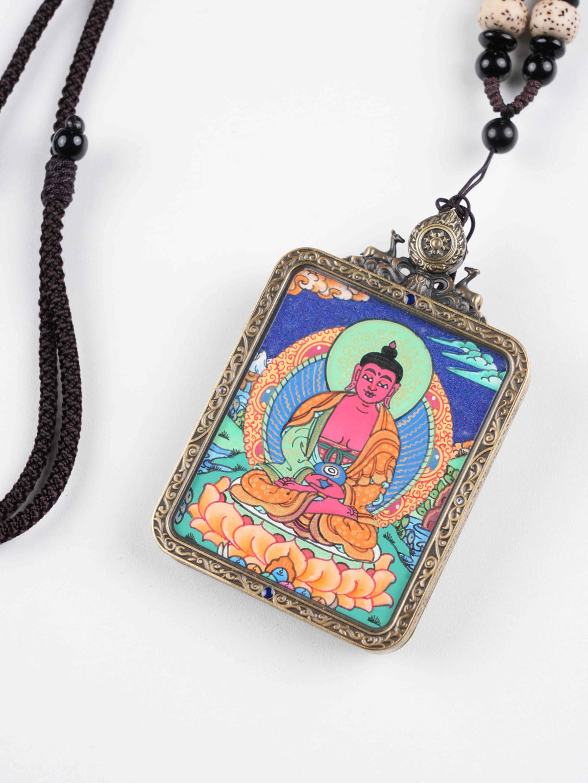 Handcrafted Amitabha Thangka miniature symbolizing rebirth and enlightenment.