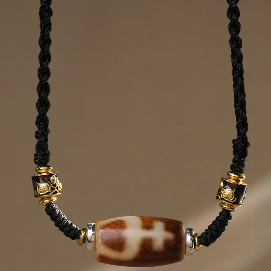 Tibetan Buddhist agate necklace featuring treasure vase Dzi bead, handcrafted amulet jewelry.