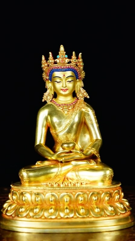 Alt Text: Exquisitely handcrafted Tibetan Buddhist statue of the Three Worlds Buddha with a gilded crown, adorned with mineral pigments. A perfect blend of Tibetan cultural essence, ideal for collection and decoration.
