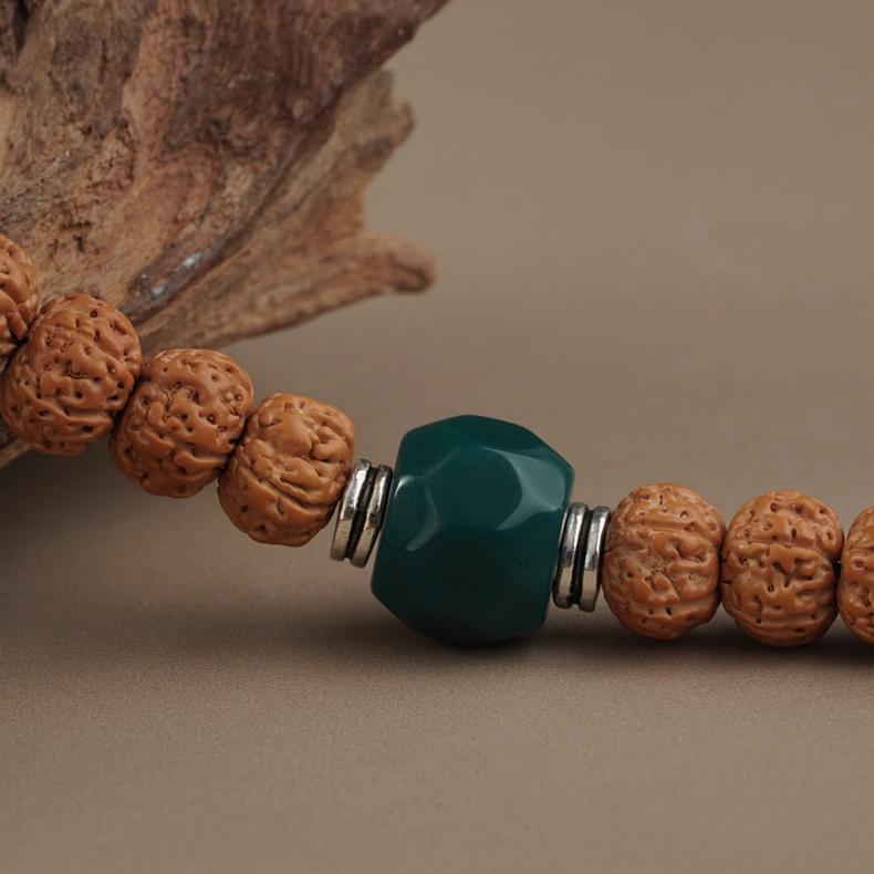 Tibetan Buddhist Bodhi and glass mala-style jewelry crafted with copper spacers.