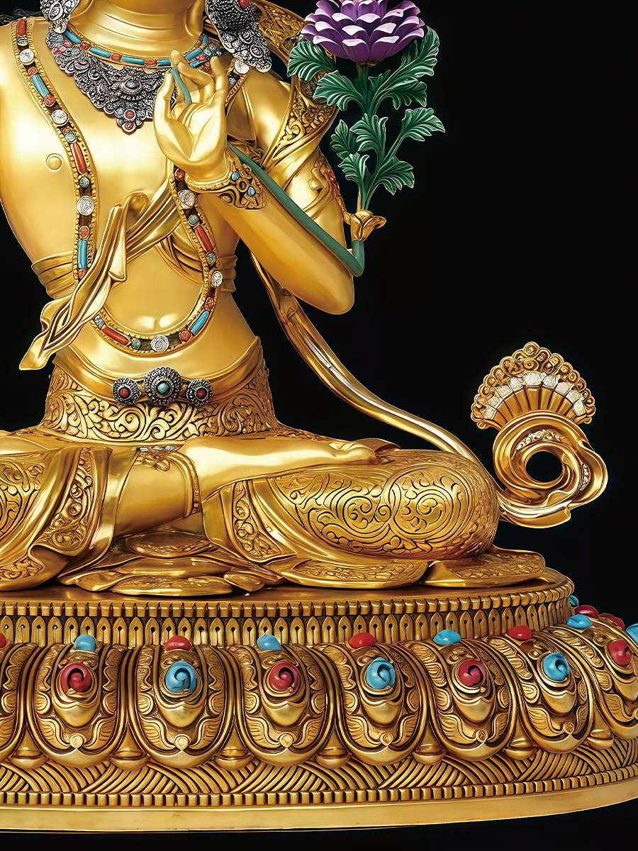 Shining golden Manjushri holding the wisdom sword, showcasing the sacred brilliance of authentic Tibetan Buddhist statues.