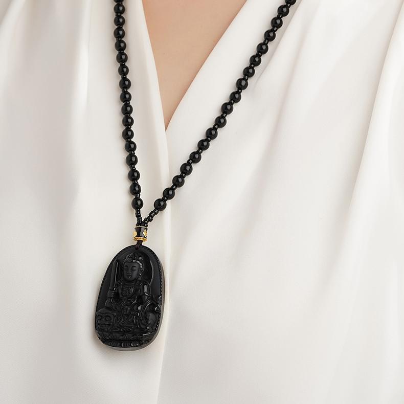 Handcrafted black obsidian necklace with Tibetan mantra design for daily meditation.