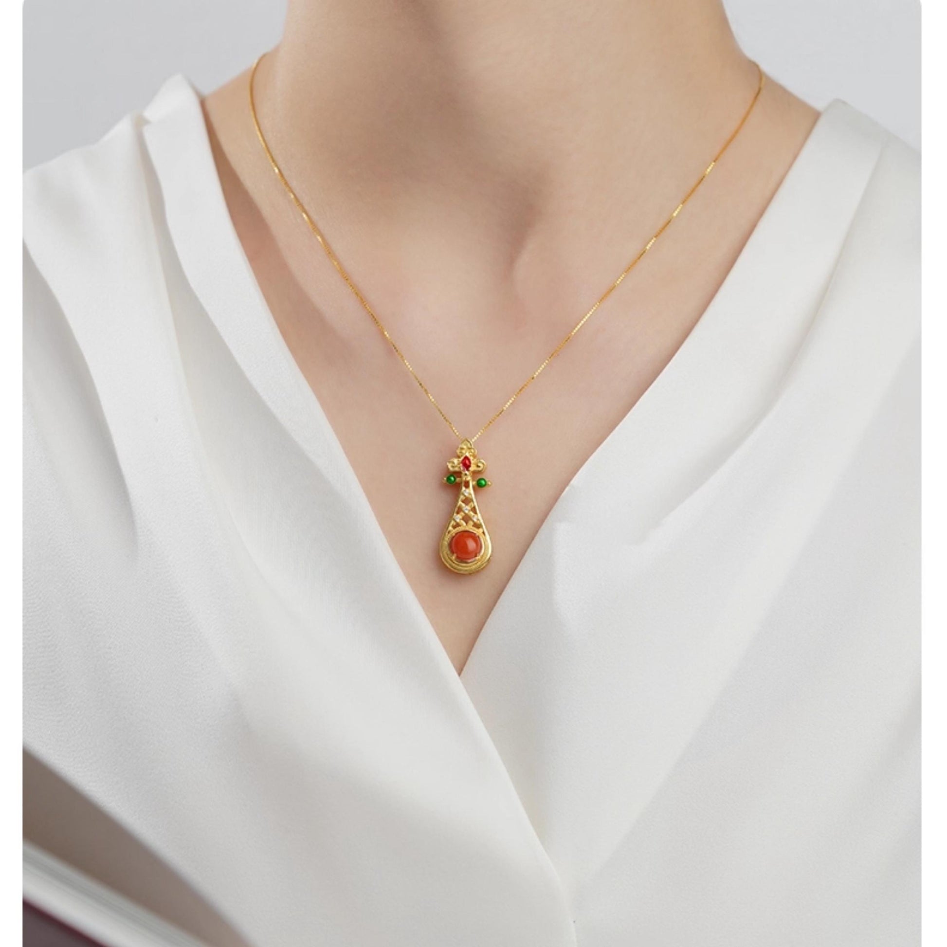 Tibetan handcrafted silver pendant with South Red Agate, representing strength, peace, and good fortune.