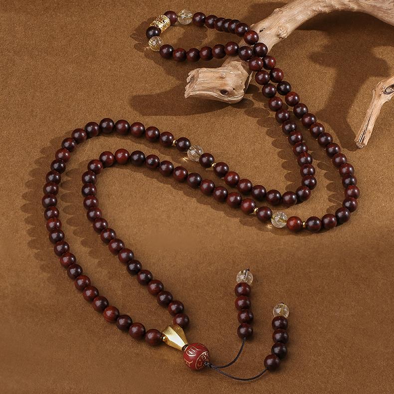 Handmade Tibetan Buddhist mala featuring little leaf sandalwood golden rutile crystal and silver details