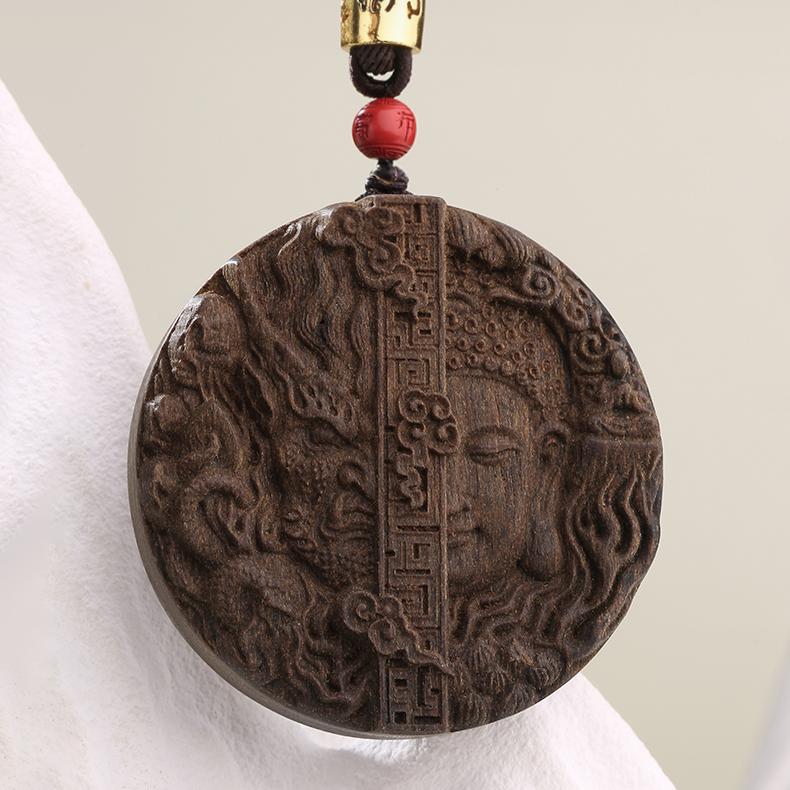 Artisanal Tibetan Buddhist agarwood sandalwood necklace featuring vermilion bead and adjustable cord.

