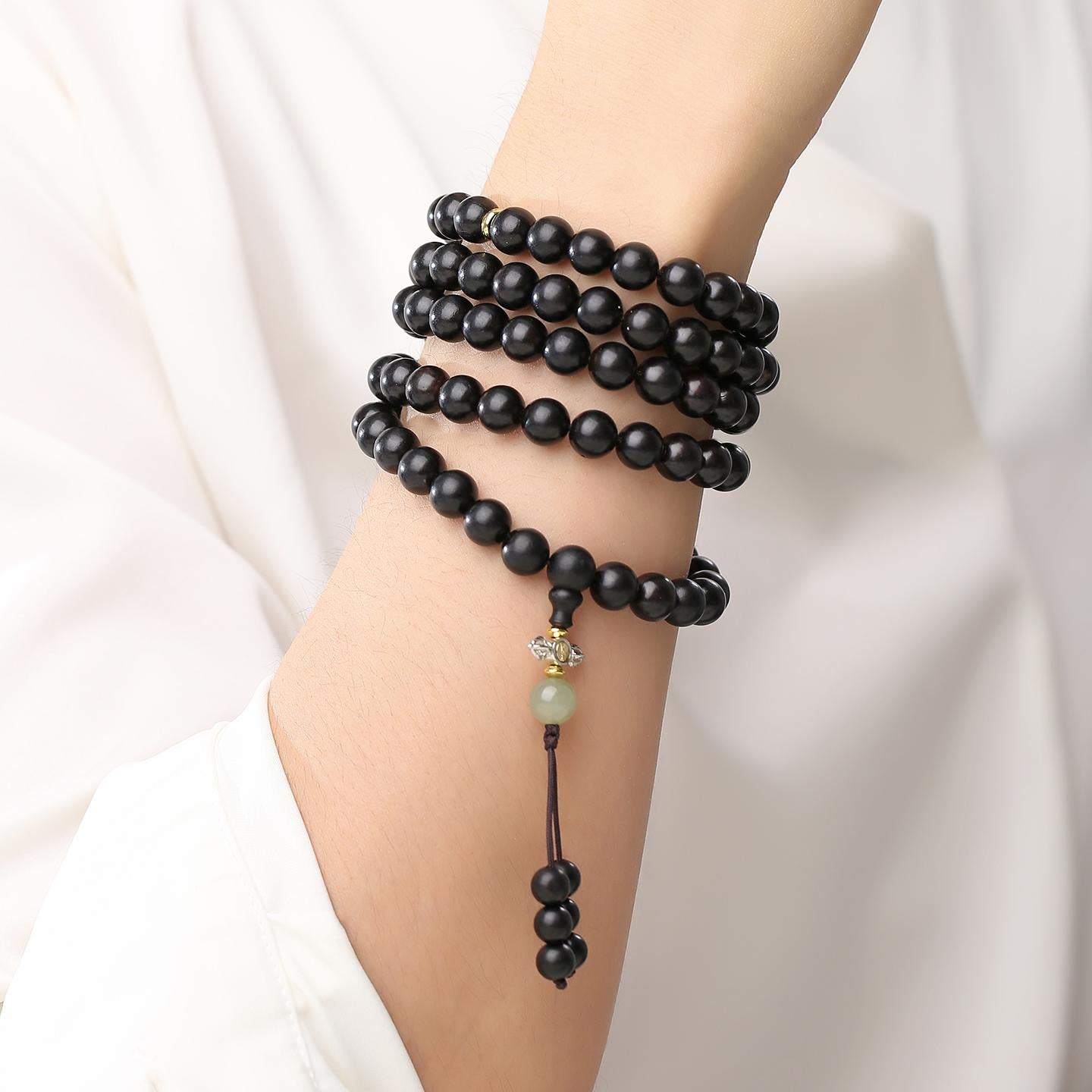 Ebony mala necklace featuring Hetian jade and copper spiritual elements