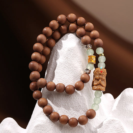 Tibetan-Buddhist “Xiang Rui Jing” handmade Australian sandalwood bracelet with carved centerpiece and copper charm
