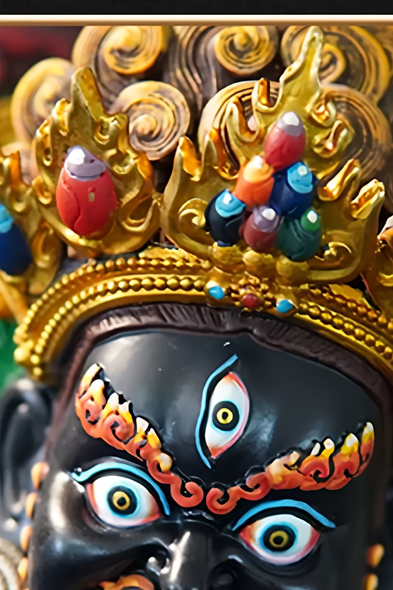 Traditional handmade sculpture of the Tibetan wealth deity, Black Jambhala, crafted from lustrous copper as a fine example of devotional Buddhist art.
