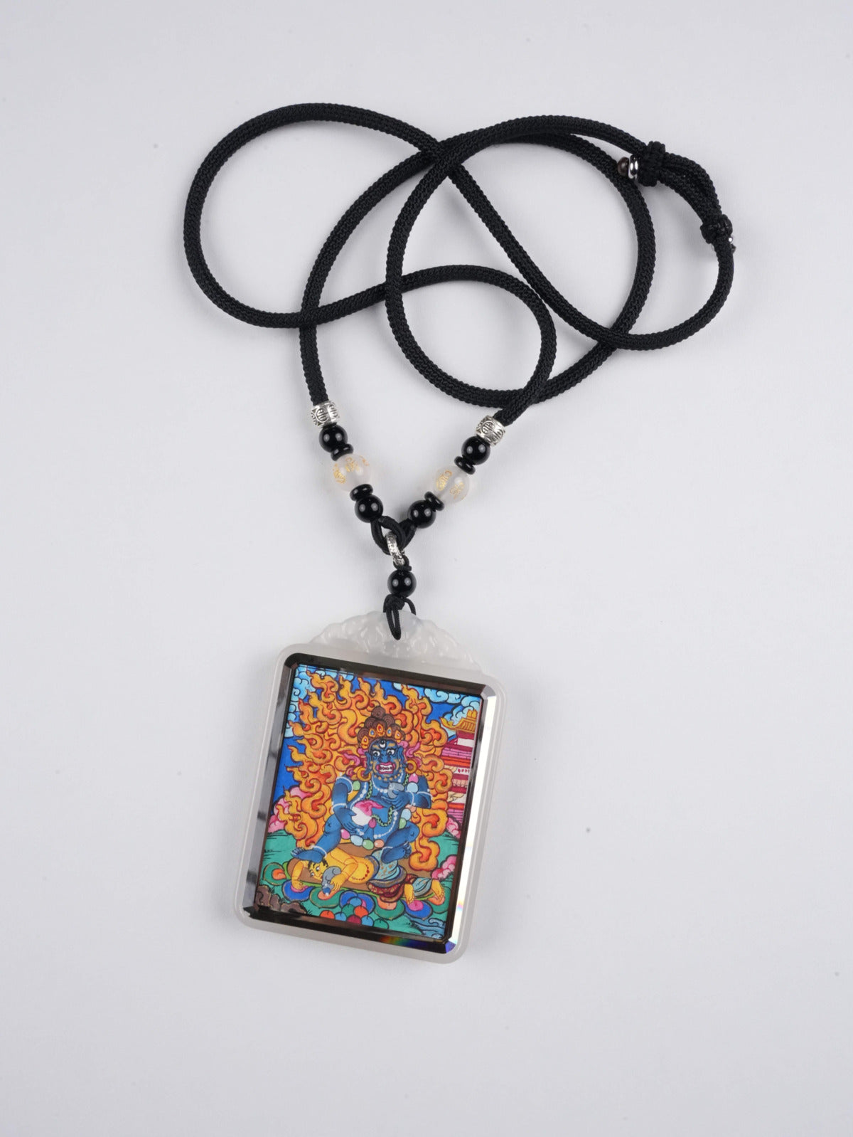 Detailed Black Jambhala thangka amulet - powerful wealth deity in Tibetan Buddhism