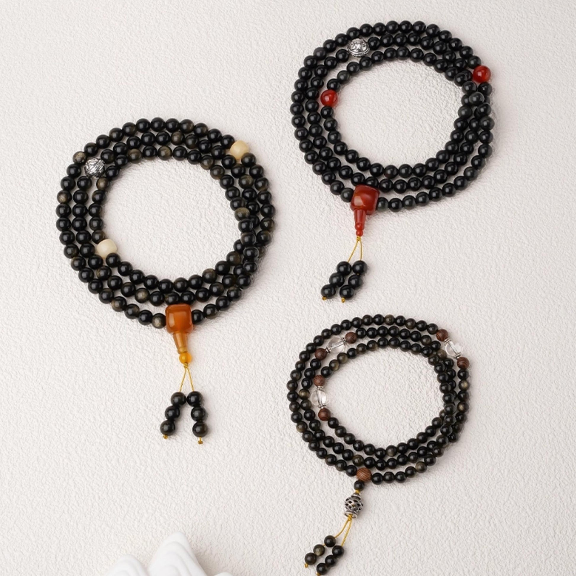 Tibetan Buddhist 108-bead mala crafted from golden obsidian, Bodhi seeds and agate accents.