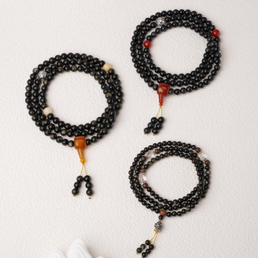 Tibetan Buddhist 108-bead mala crafted from golden obsidian, Bodhi seeds and agate accents.