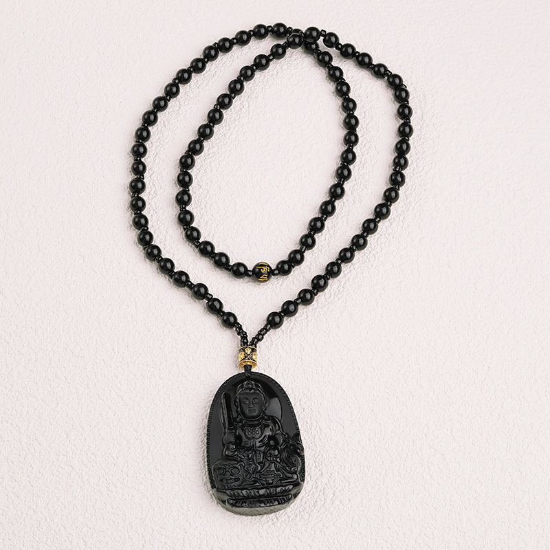 Black obsidian mantra necklace featuring the Six-Syllable Mantra for peace and spiritual strength.