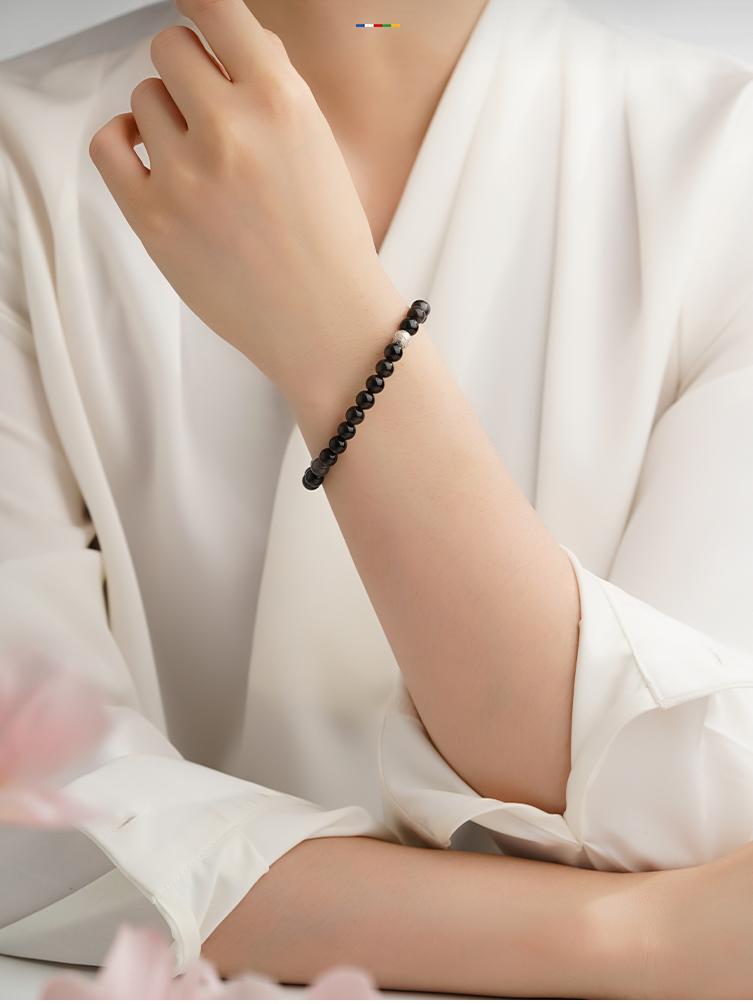 Black silver obsidian Xingye bracelet with 6mm stones and 925 silver mantra bead, handmade for spiritual daily wear.
