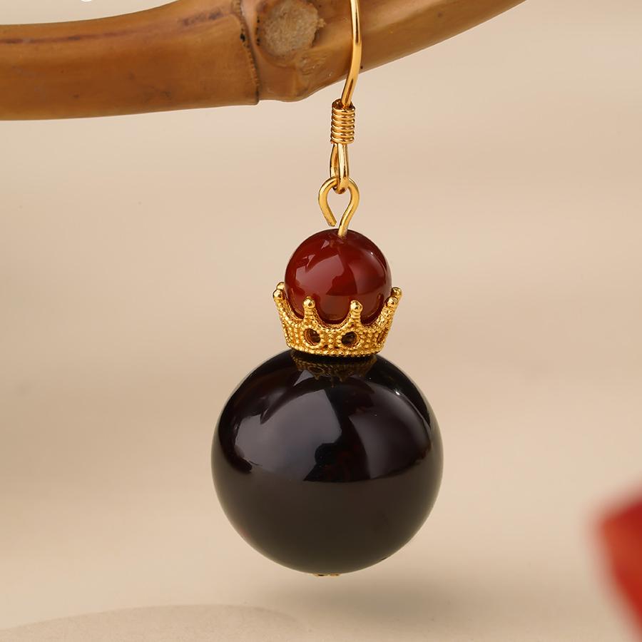 "Artisan-crafted Tibetan Buddhist blood amber and agate earrings with 925 silver, symbolizing clarity, protection, and spiritual energy."