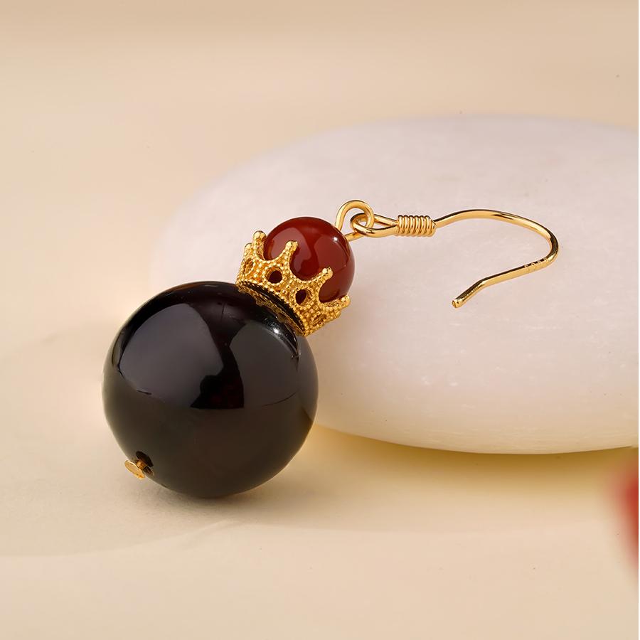 "Tibetan Buddhist blood amber agate earrings with 925 silver crown, handcrafted for spiritual protection and vitality."