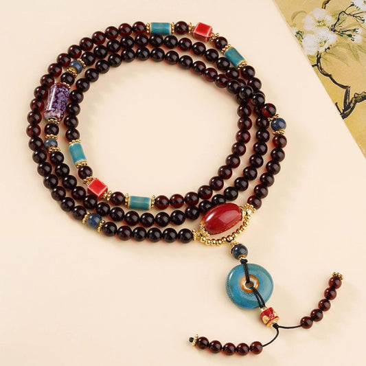 Handcrafted Tibetan Buddhist 108 beads blood amber and ceramic mala necklace for meditation and prayer