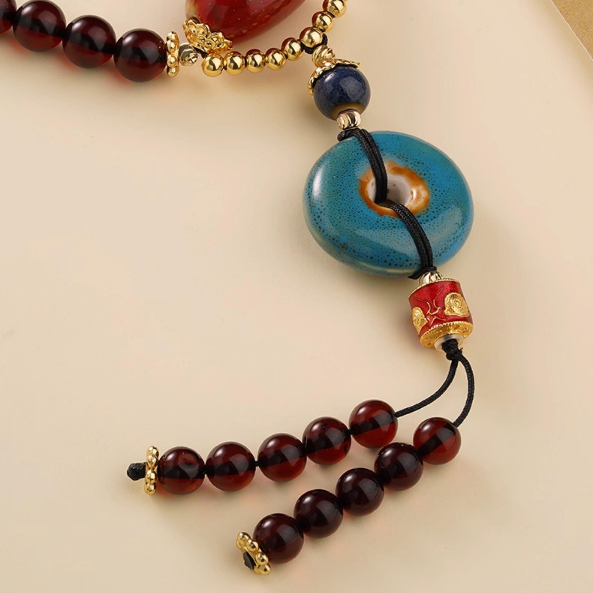 Handmade 108 beads mala combining blood amber and ceramic for balance and prosperity