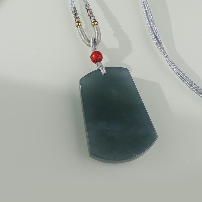 Blue water jade pendant with cinnabar Potala Palace bead for blessings and harmony.