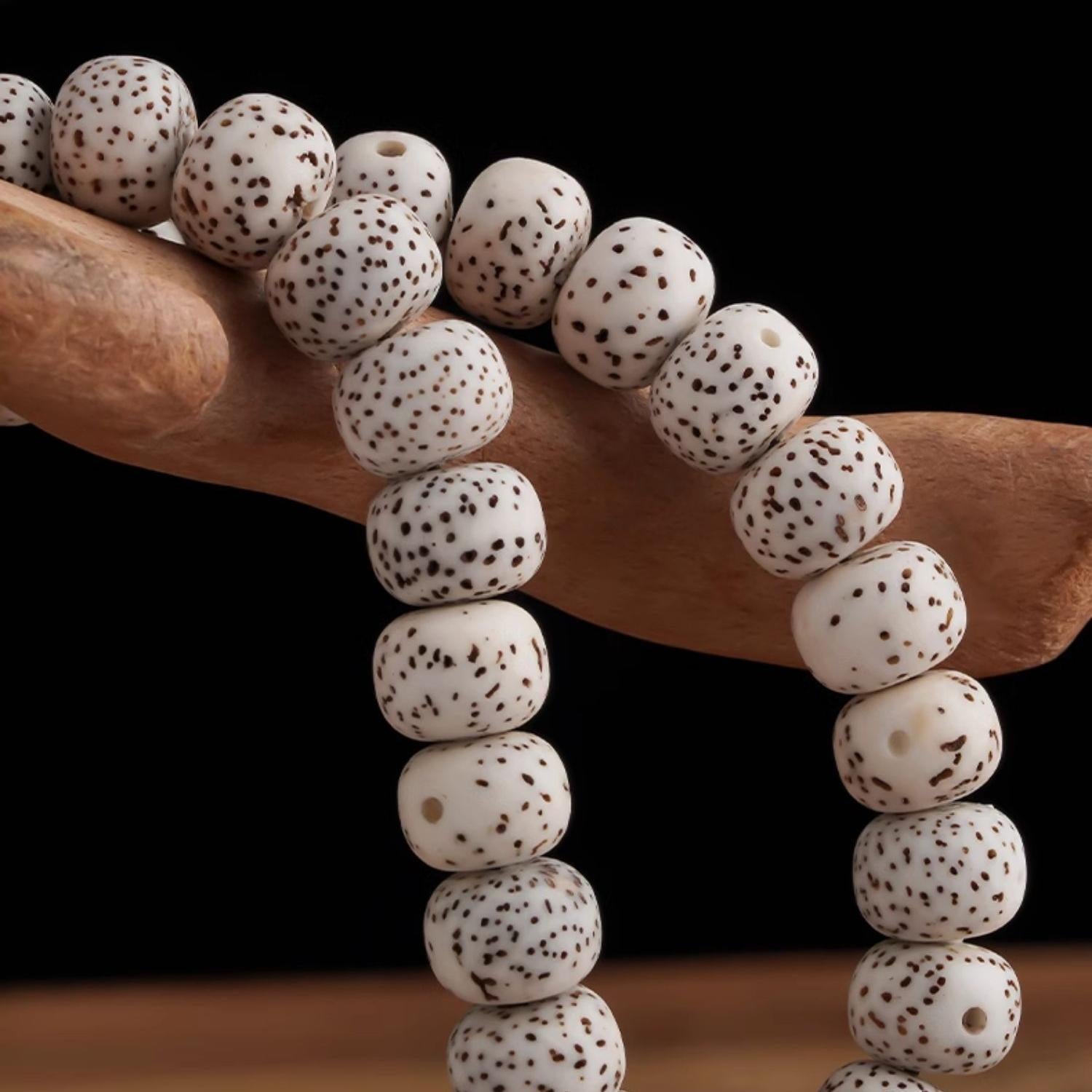 Artisan Tibetan Buddhist Bodhi mala with incense-ash mantra bead, chalcedony, agate, and olive-pit carvings.
