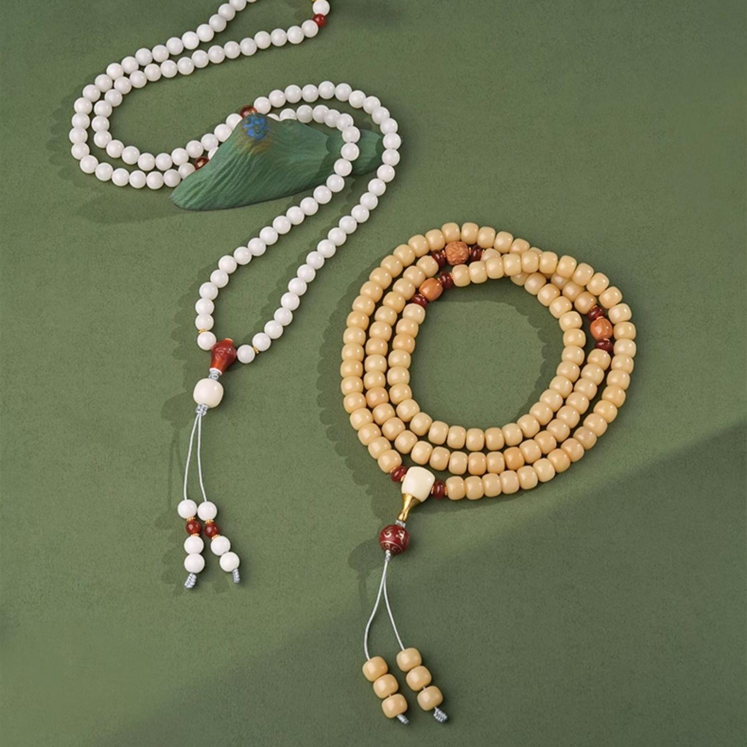 Tibetan Buddhist bodhi and agate mala featuring handmade silver elements for spiritual practice.