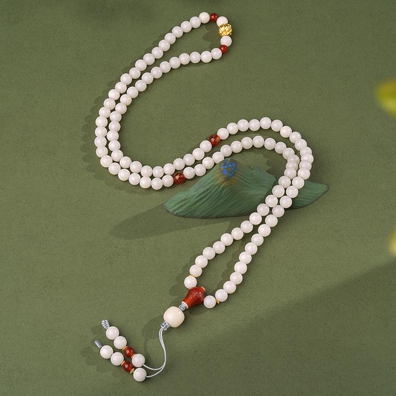 Bodhi bead necklace with agate mantra beads and Tibetan-inspired handmade details.
