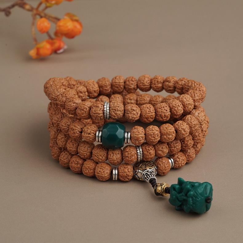Handmade Tibetan Buddhist vajra Bodhi and glass bead strand with copper accents.