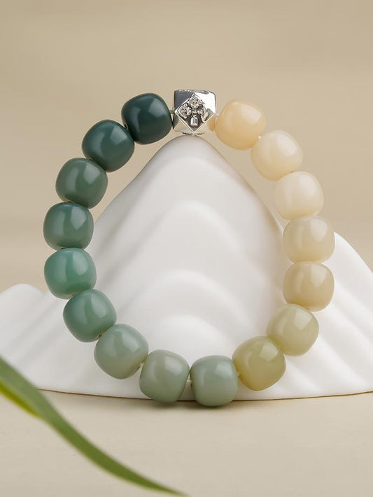 Handmade Tibetan-Buddhist Bodhi bracelet Yunmian Yuhou with 12x11mm Bodhi beads and sterling silver eight-facet bead.