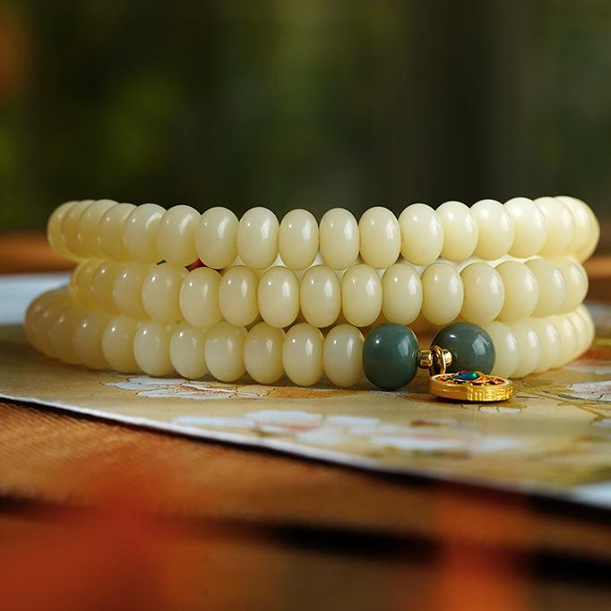 Artisan Tibetan-Buddhist Bodhi mala Yunshui Jing with 66cm elastic cord and alloy happiness pendant.