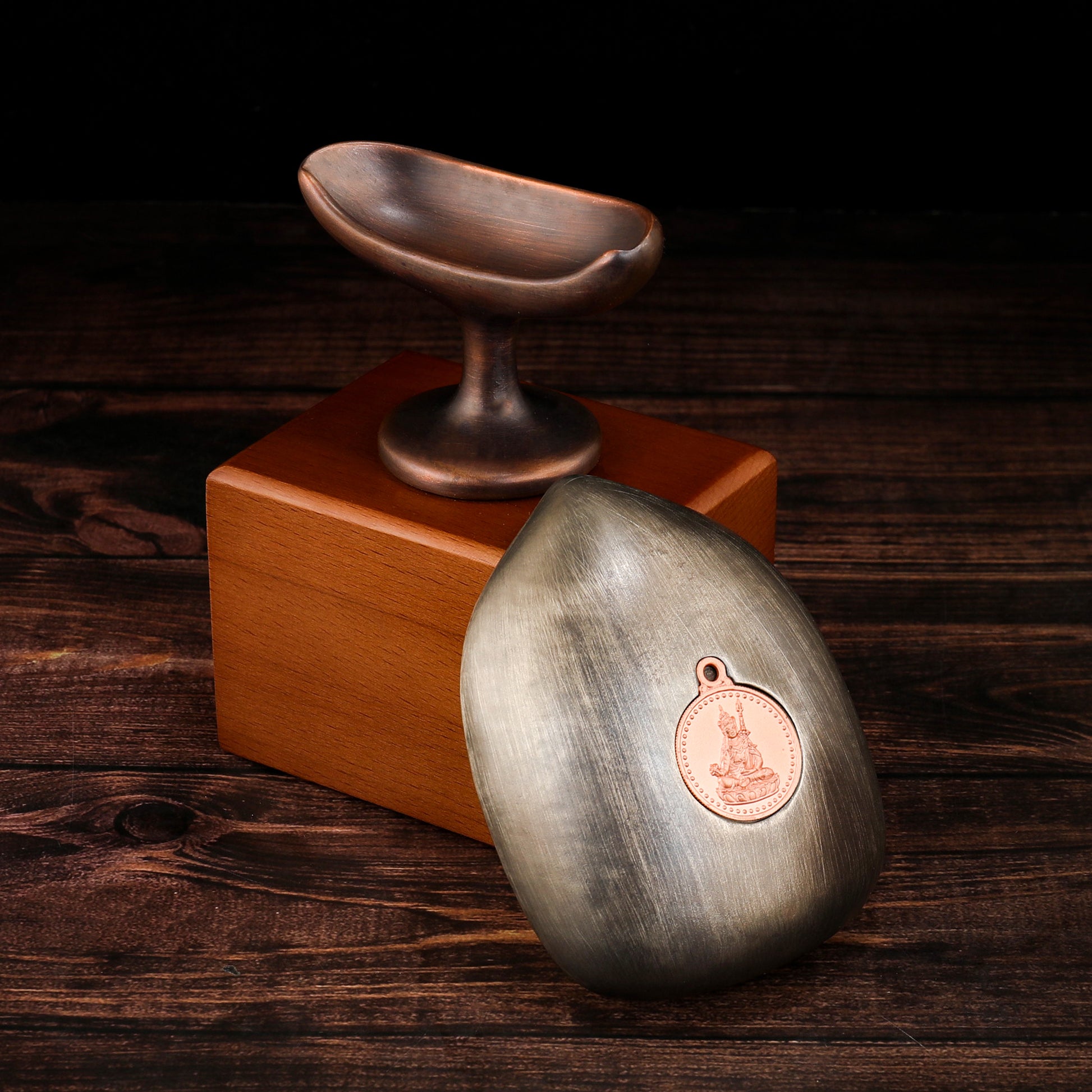 Purple copper and sandalwood Tibetan tsatsa sacred ornament.