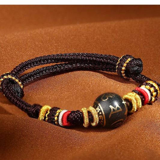 Handmade Tibetan Buddhist brown bracelet with incense-ash embedded Six-Syllable Mantra bead, adjustable 16cm design.