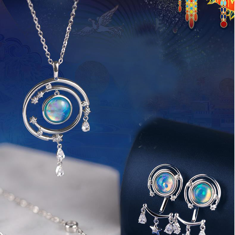 Elegant handmade silver earrings with enamel and simulated opal, inspired by Tibetan Buddha culture.