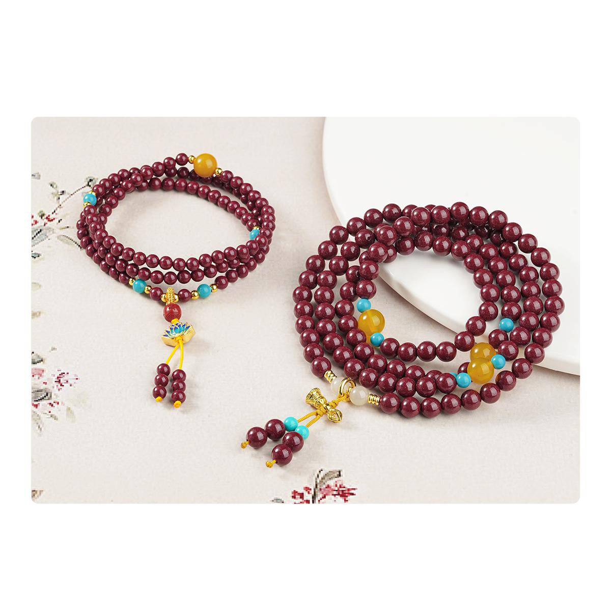 Cinnabar 108 Buddhist mala featuring amber, glass and copper bells, handcrafted Tibetan jewelry.