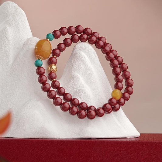 Handcrafted Tibetan Buddhist cinnabar multi wrap bracelet with amber turquoise and silver mantra bead