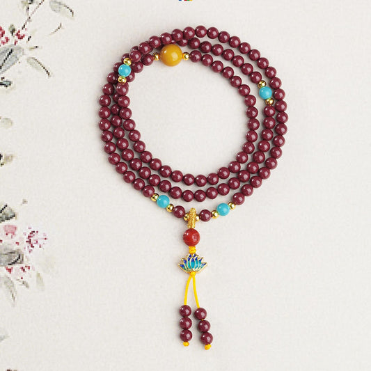 Handmade Tibetan Buddhist cinnabar 108 mala with amber, glass beads and copper details, spiritual meditation jewelry.