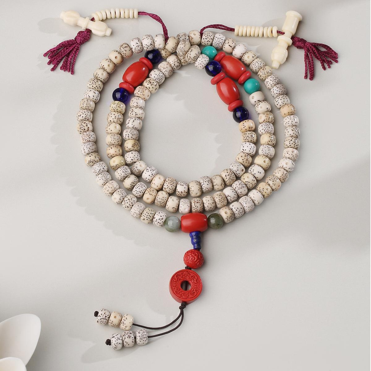 Handcrafted Tibetan Buddhist cinnabar and bodhi seed mala with lapis lazuli connector
