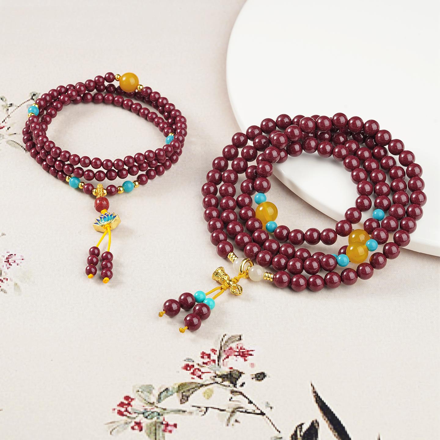 Handcrafted cinnabar mala with 108 beads, copper elements and Tibetan jewelry aesthetics.