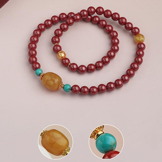 Tibetan Buddhist cinnabar wrap bracelet jewelry art featuring amber turquoise and 925 silver