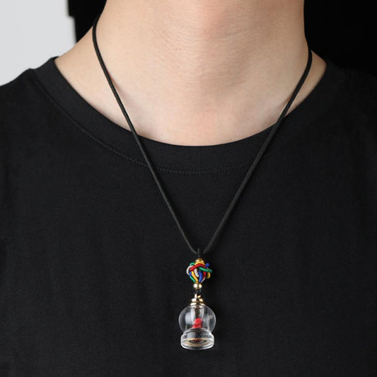 Tibetan Buddhist crystal vase amulet representing abundance, clarity, and spiritual peace.
