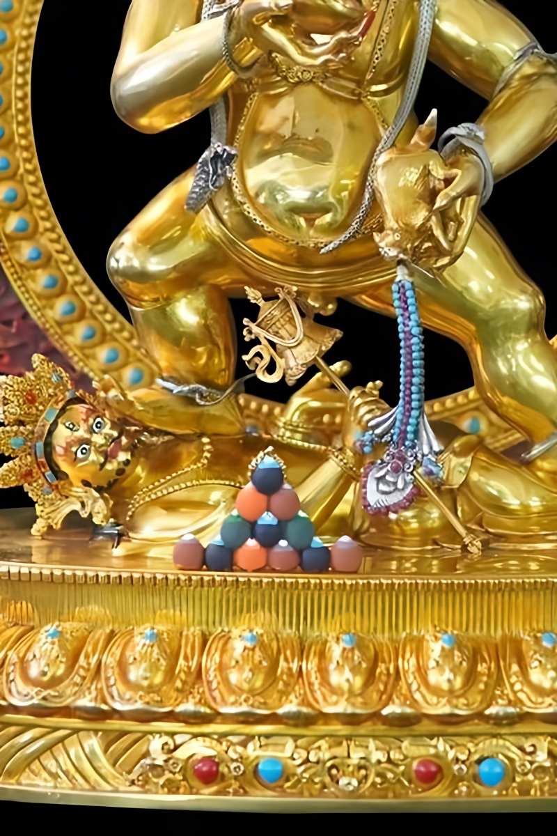 Sacred Tibetan Buddhist Black Jambhala statue made with mineral paints on copper, demonstrating exquisite Buddhist art.