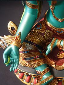 Handmade Tibetan-buddhist Green Tara statue in pure copper with mineral pigments, a sacred Tibetan Buddha art symbolizing compassion and protection.