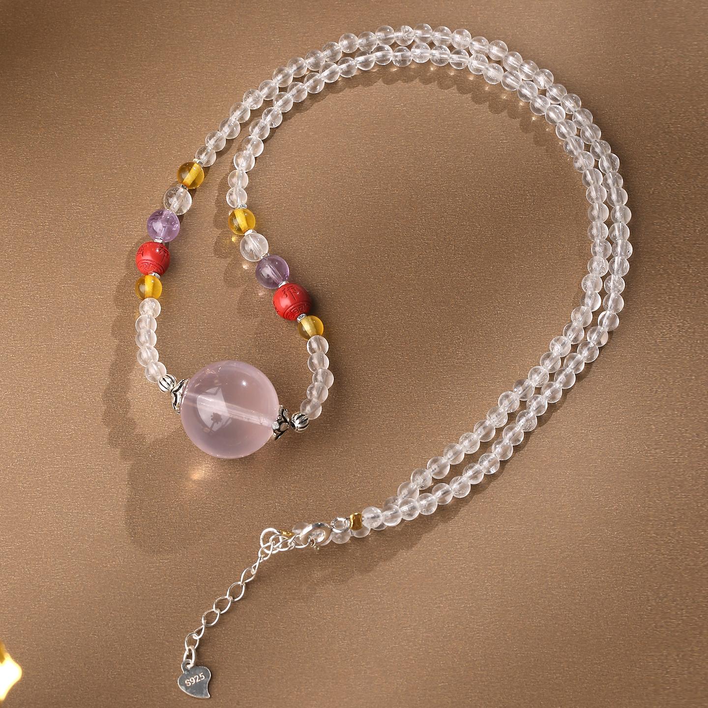Handcrafted white crystal and cinnabar necklace inspired by Tibetan Buddhist jewelry art.