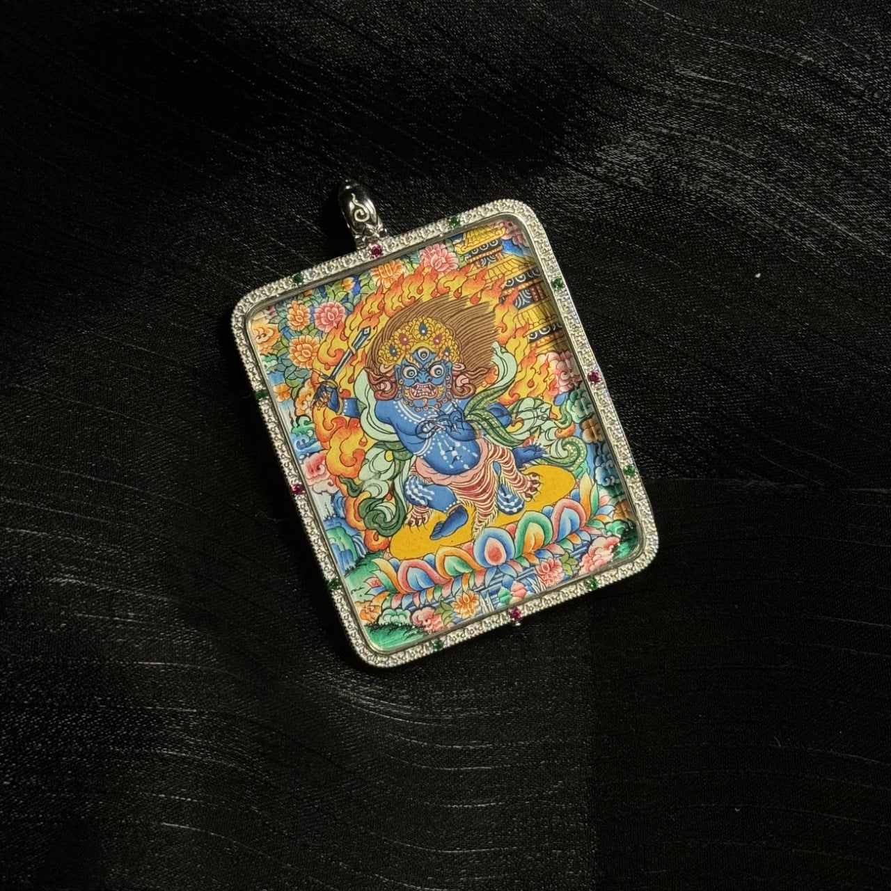 Detailed view of the protective casing with dual-sided card holder for the Acala Thangka pendant, symbolising protection and versatility in Buddhist tradition.

