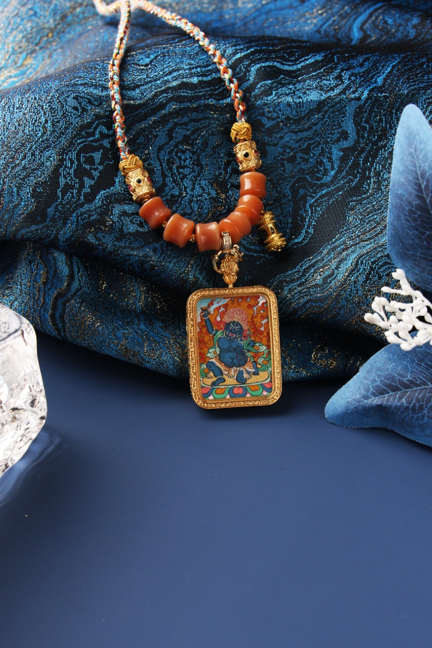  A 4x5cm hand-painted Karma Kagyu Acala Thangka pendant featuring the Immovable Wisdom King, encased in titanium steel, representing fierce compassion and obstacle removal in Tibetan Buddhist tradition.

