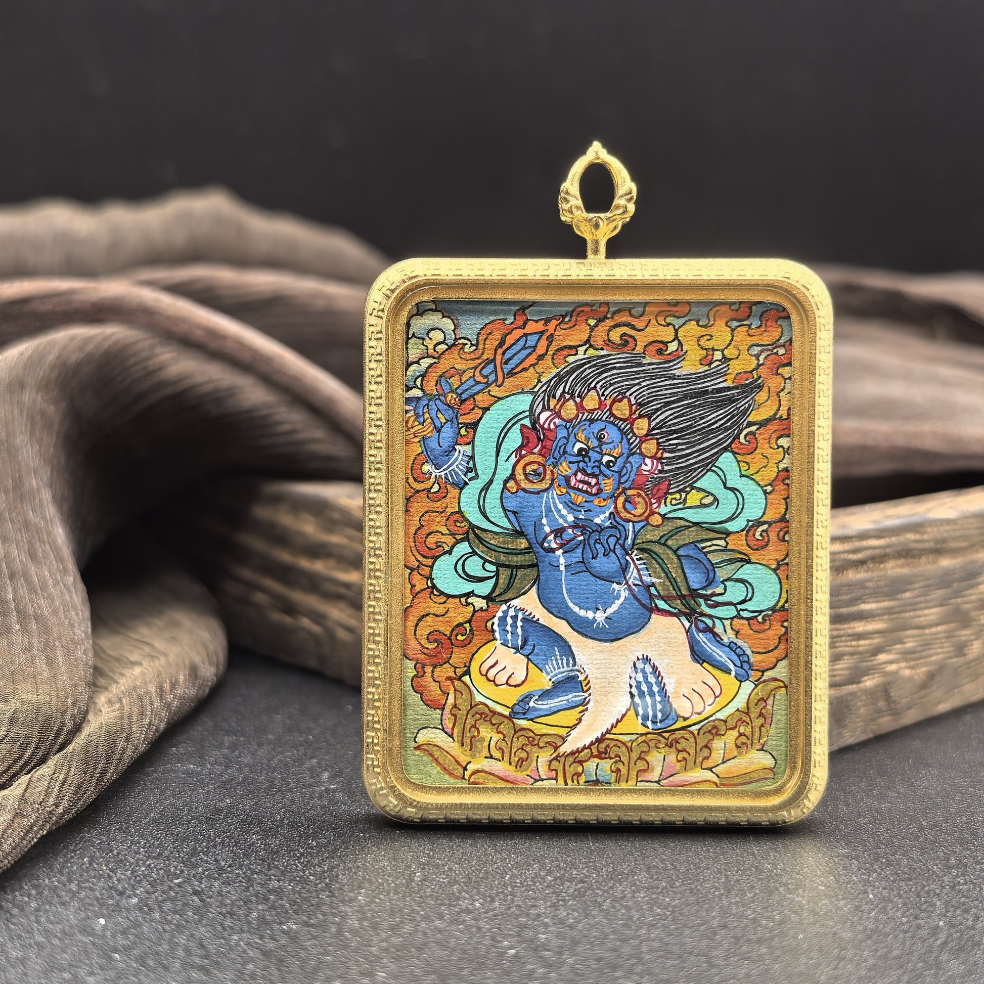  Detailed view of the titanium casing for the Acala Thangka pendant, symbolising protection and tradition in Buddhist practice.
