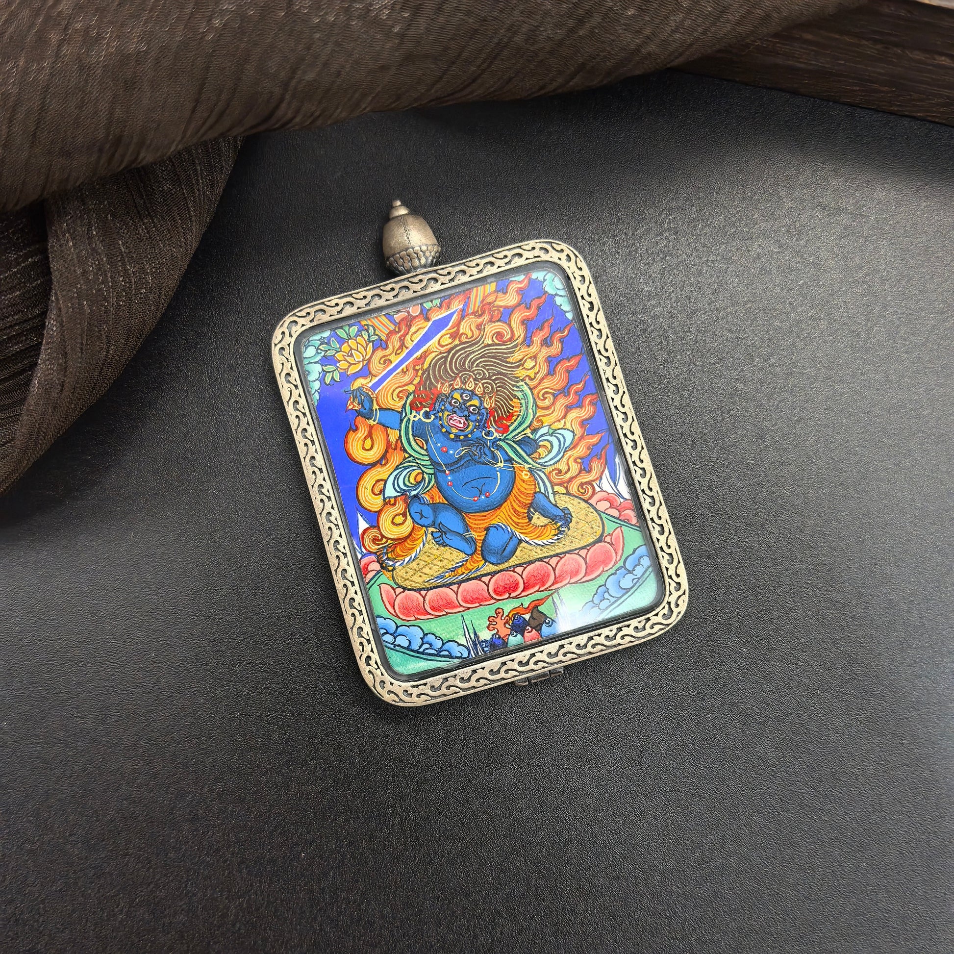  A 3.5x4.5cm hand-painted Rekong Acala (不动明王) Thangka pendant with 925 silver featuring the chief of the Five Wisdom Kings, representing protection and discipline in Buddhist tradition.

