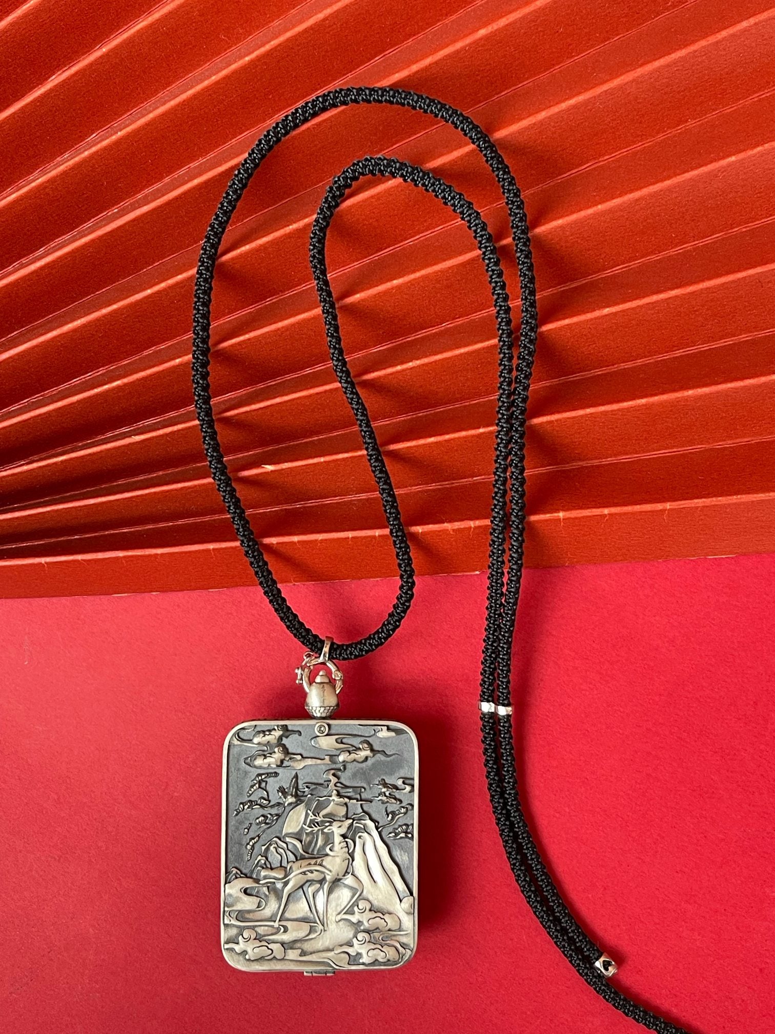  Detailed view of the deer relief silver casing for the Acala Thangka pendant, symbolising protection and tradition in Buddhist practice.

