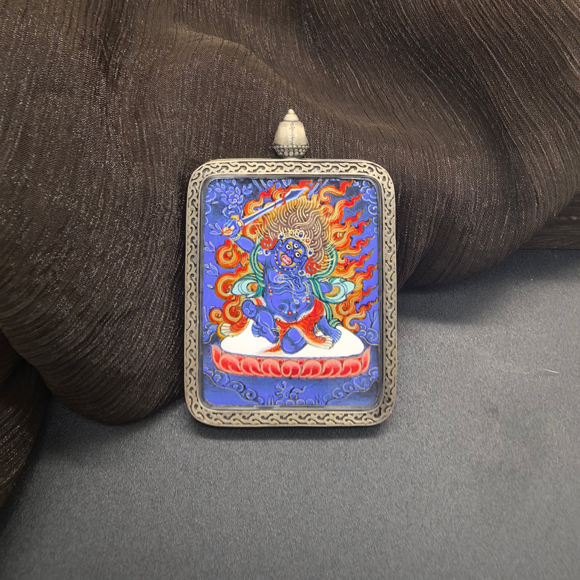  Close-up detail of the Rekong Blue Thangka Acala painting showing natural mineral pigments, showcasing the masterful artistry of Rekong lama painters.

