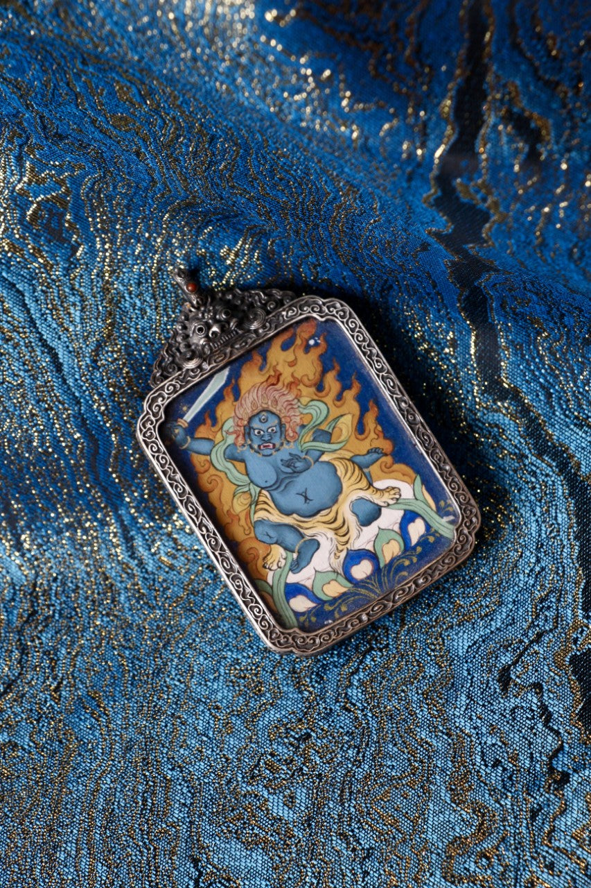 Acala Vidyaraja thangka pendant depicting the immovable wisdom king in Tibetan Buddhist culture, symbolizing determination and inner strength.