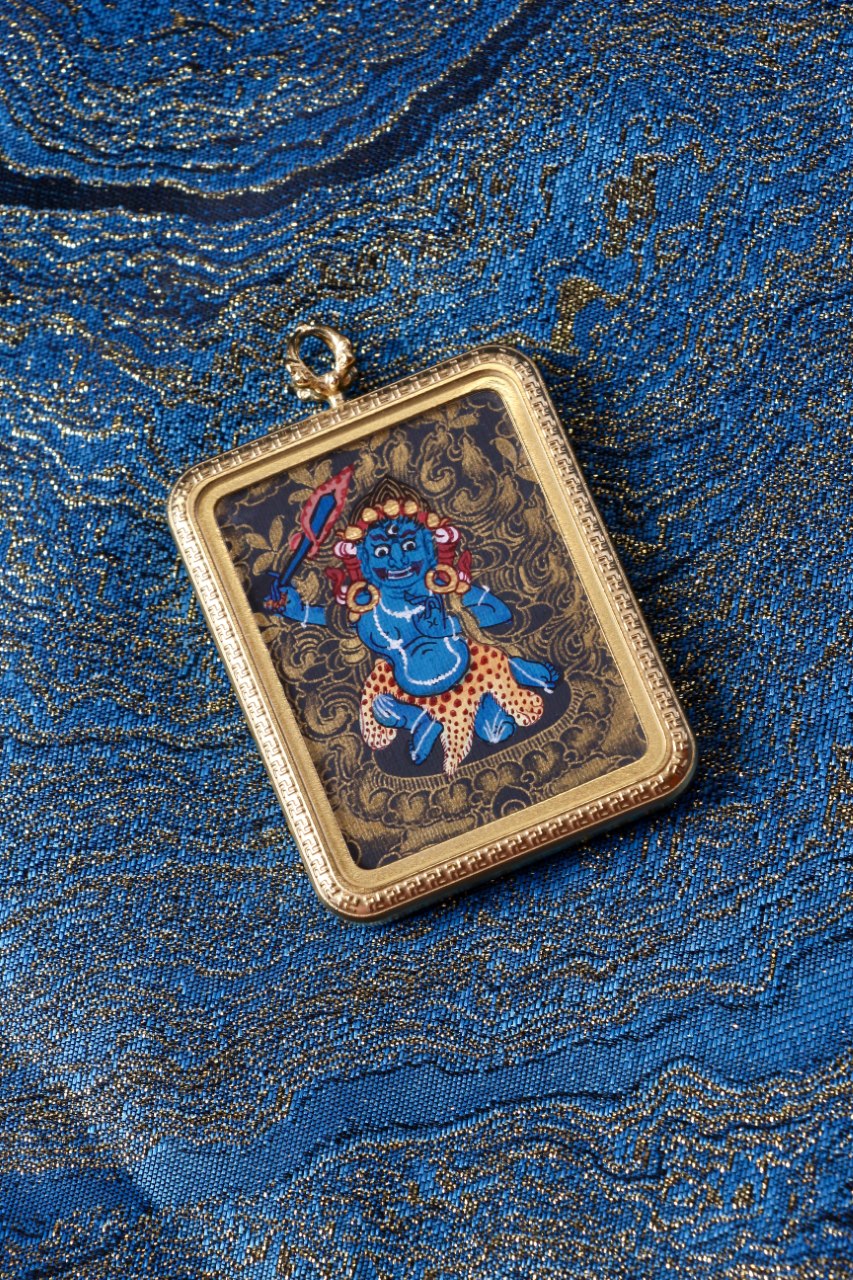 Acala Vidyaraja thangka pendant depicting the immovable wisdom king in Tibetan Buddhist culture, symbolizing steadfast resolve and inner strength.